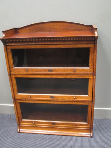 Lot 344 - A "LEBUS" oak three tier stacking bookcase...