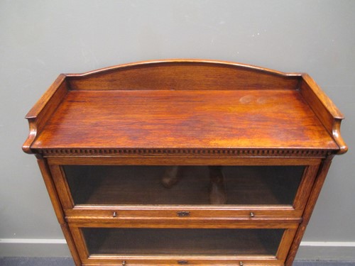 Lot 344 - A "LEBUS" oak three tier stacking bookcase...