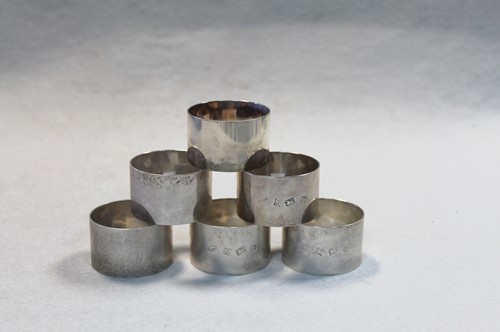 Lot 614 - A set of six 20th Century silver napkin rings