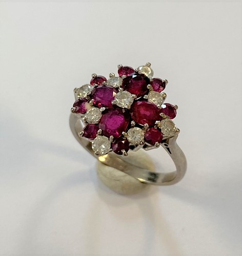 Lot 155 - A modern ruby & diamond cluster ring