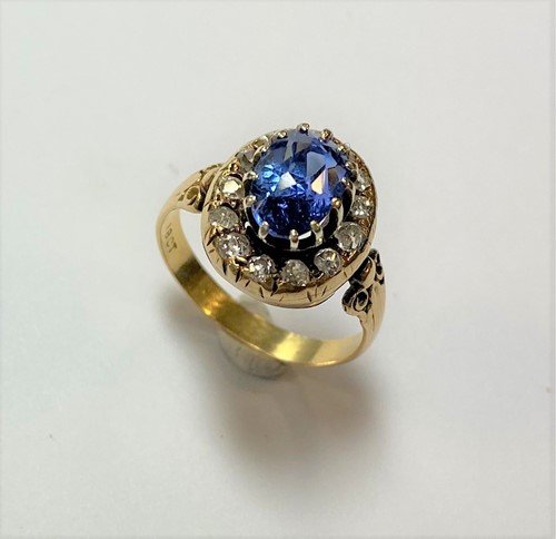 Lot 178 - A late 19th Century sapphire and diamond cluster ring