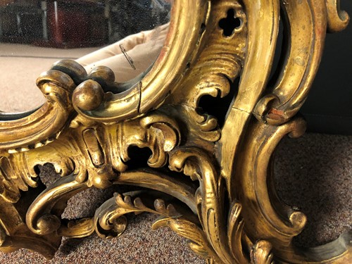 Lot 36 - A carved rococo style giltwood mirror, 19th century