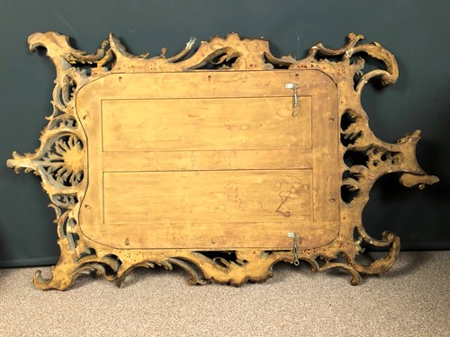 Lot 36 - A carved rococo style giltwood mirror, 19th century