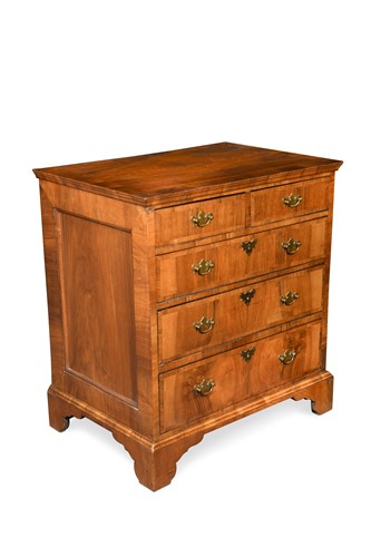 Lot 144 - A walnut veneered and cross banded chest