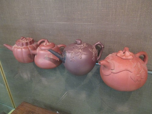 Lot 152 - Three Chinese yixing type teapots, another of...