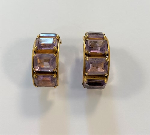 Lot 63 - A pair of amethyst set hoop style ear clips