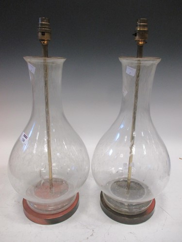 Lot 139 - A pair of baluster glass bubble form lamps
