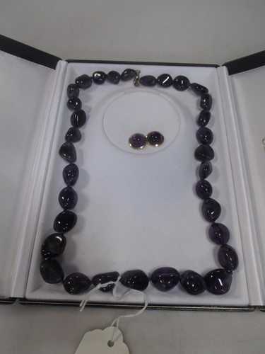 Lot 252 - Amethyst bead necklace and a pair of round...