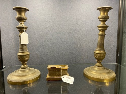 Lot 41 - A pair of French gilt bronze candlesticks, early 19th century