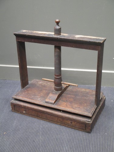 Lot 570 - A 19th century oak and elm book/flower press,...