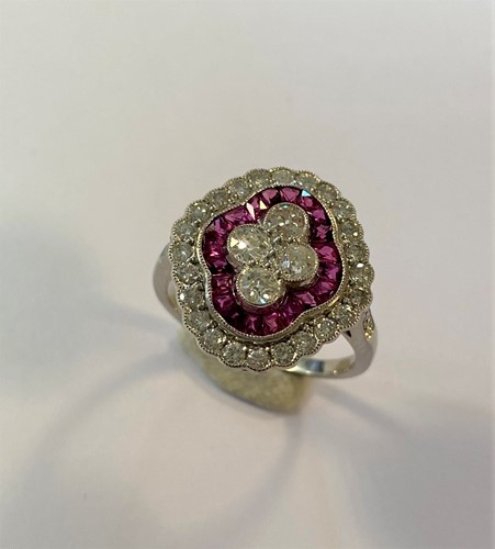 Lot 153 - An Art Deco style ruby and diamond cluster ring