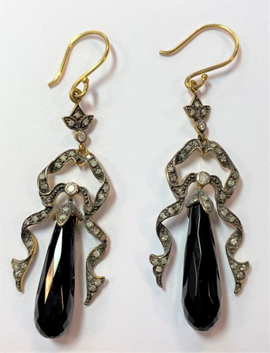 Lot 49 - A pair of long drop earpendants set with diamonds and jet