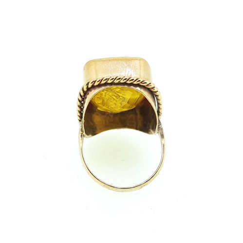 Lot 13 - A dress ring with a carved intaglio citrine