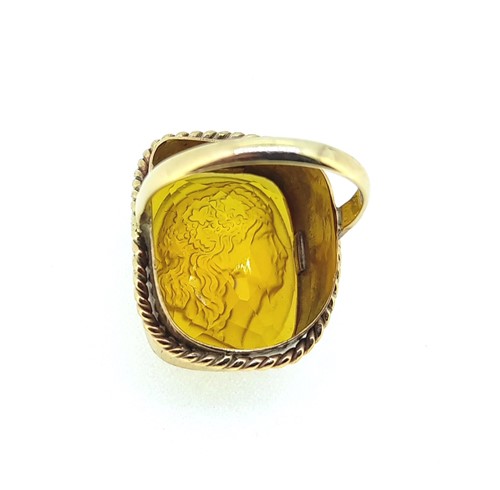 Lot 13 - A dress ring with a carved intaglio citrine