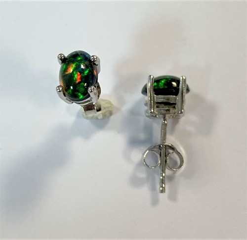 Lot 93 - A pair of black opal earstuds