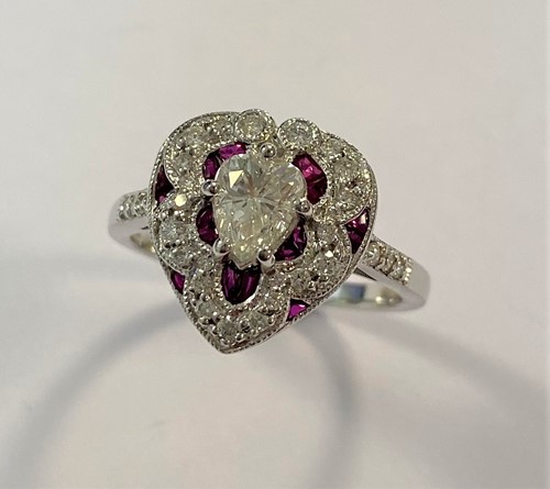 Lot 150 - A Victorian style ruby and diamond heart shaped cluster ring