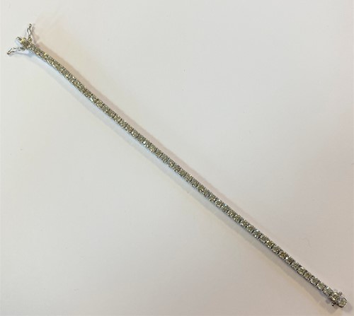 Lot 182 - A diamond line bracelet set in white gold