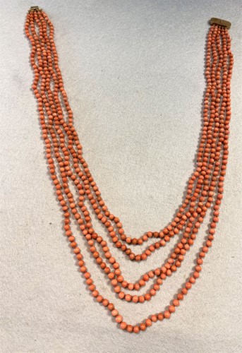 Lot 267 - A five row coral bead necklace
