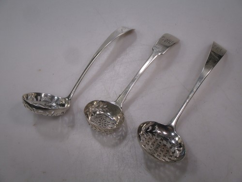 Lot 279 - Two George III and one William IV silver sugar...