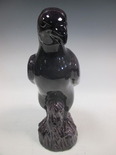 Lot 95 - A 19th century Chinese purple glazed parrot...