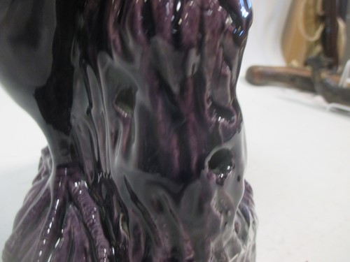 Lot 95 - A 19th century Chinese purple glazed parrot...