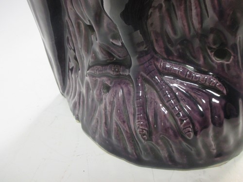 Lot 95 - A 19th century Chinese purple glazed parrot...