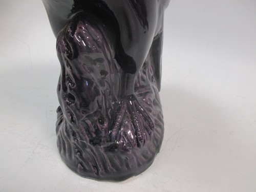 Lot 95 - A 19th century Chinese purple glazed parrot...