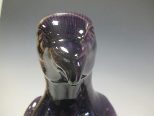 Lot 95 - A 19th century Chinese purple glazed parrot...