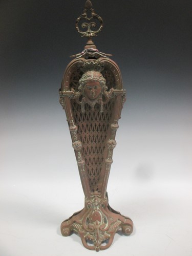 Lot 663 - A brass fan fender, 72cm high; a brass pierced...