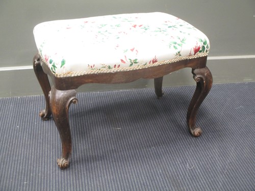 Lot 599 - A George II style stool, with shaped frieze...