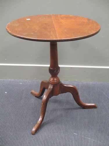 Lot 689 - A George III mahogany tripod table, 63cm diameter
