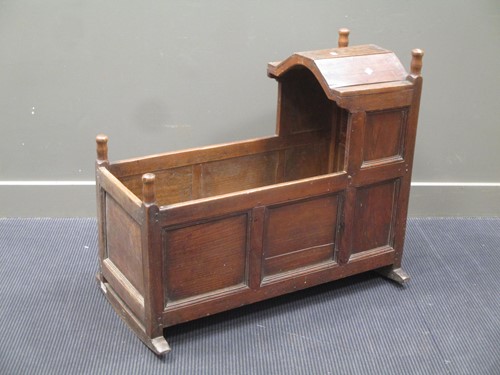 Lot 643 - An 18th century and later oak cradle, 92cm long