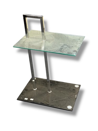 Lot 621 - After Eileen Gray, a chrome and glass...