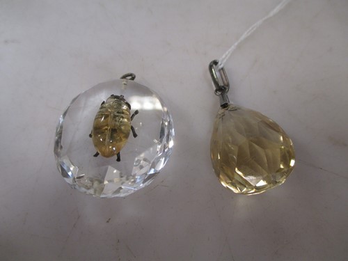 Lot 262 - Quartz oval pendant with an insect and a pear...
