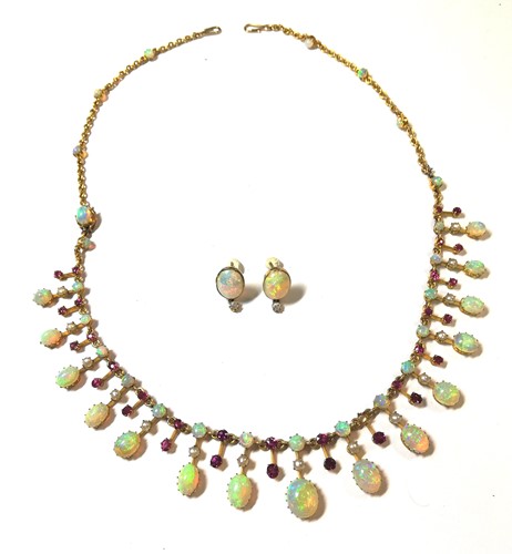 Lot 85 - An opal and ruby fringe necklace with opal earstuds en suite