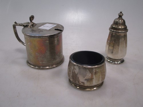 Lot 283 - A silver drum mustard with blue glass liner...