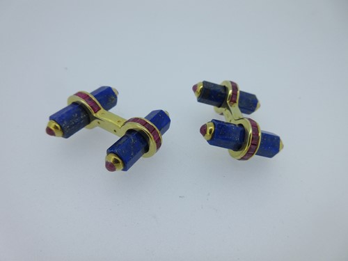 Lot 115 - A pair of baton cufflinks each set with lapis lazuli and rubies