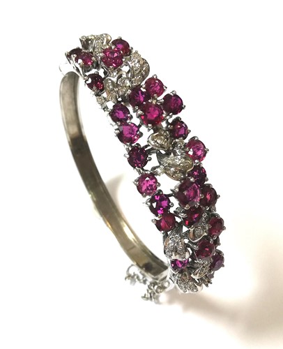 Lot 157 - A modern ruby and diamond hinged bangle