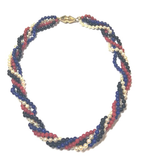 Lot 40 - A torsade of lapis lazuli, coral, cultured pearl and onyx beads