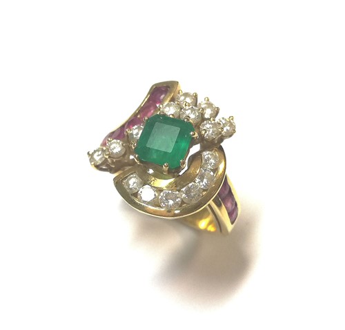 Lot 95 - A modern emerald, diamond and ruby cluster ring