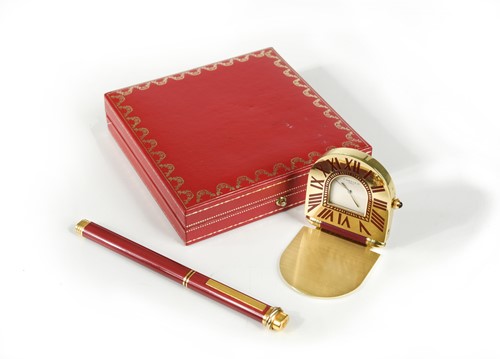 Lot 110 - Cartier - A 'must de Cartier' travelling alarm clock and ballpoint pen