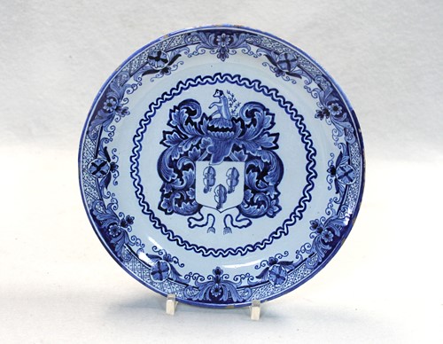 Lot 44 - An 18th century Delft blue and white armorial plate