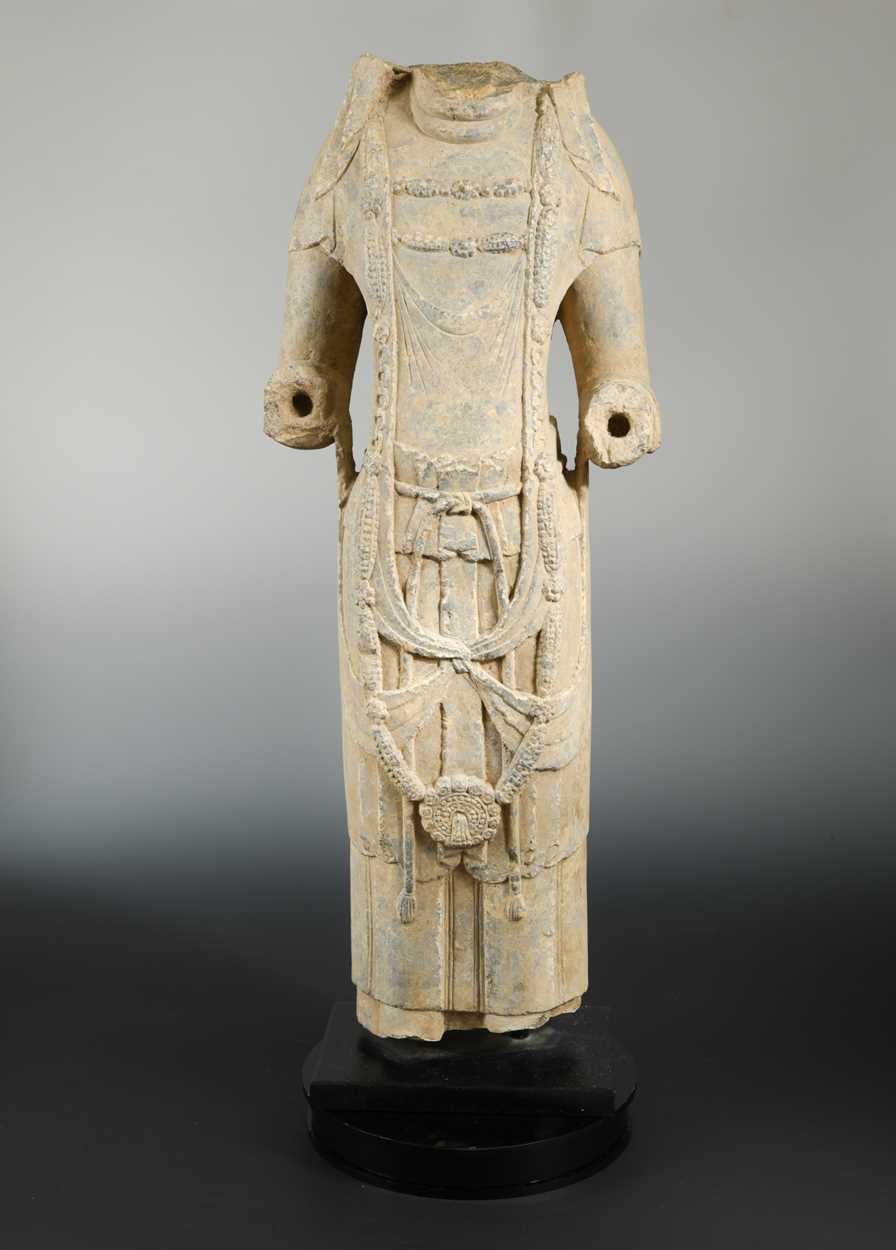 Lot 143 - A grey stone/limestone standing Bodhisattva