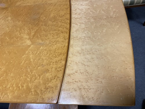 Lot 168 - An Art Deco birdseye-maple draw-leaf dining table