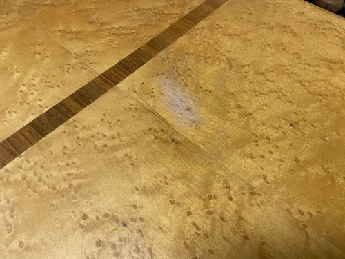 Lot 168 - An Art Deco birdseye-maple draw-leaf dining table