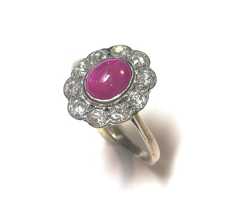 Lot 151 - A ruby and diamond cluster ring