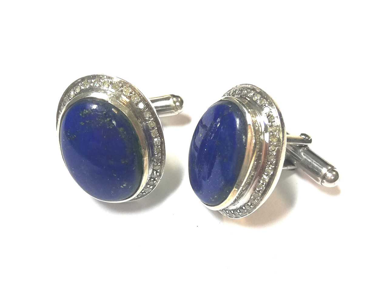 Lot 15 - A pair of modern cufflinks set with diamonds and lapis lazuli