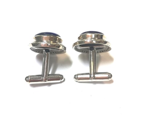 Lot 15 - A pair of modern cufflinks set with diamonds and lapis lazuli