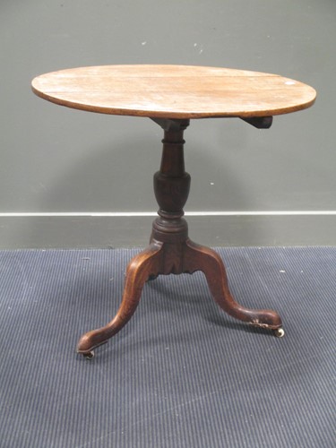 Lot 615 - George III oak tripod table 77cm diameter
