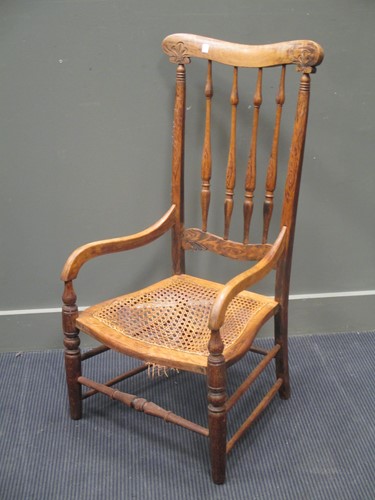 Lot 650 - A cane seated armchair with high back